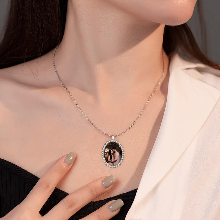 Silver photo pendant necklace with oval bezel and rhinestone edge