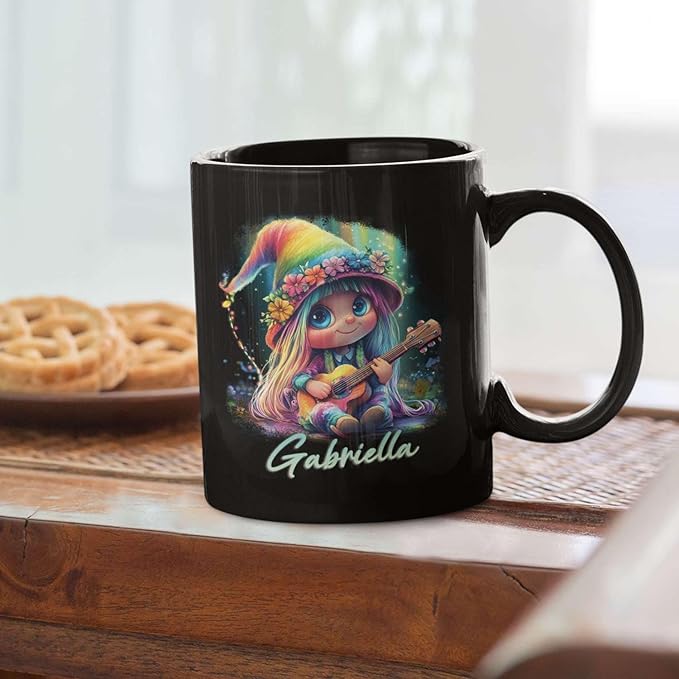 Black ceramic mug with rainbow-hat guitar girl illustration and name Gabriella