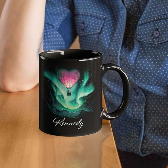 Black ceramic coffee mug with green aurora hot air balloon heart design and Kennedy