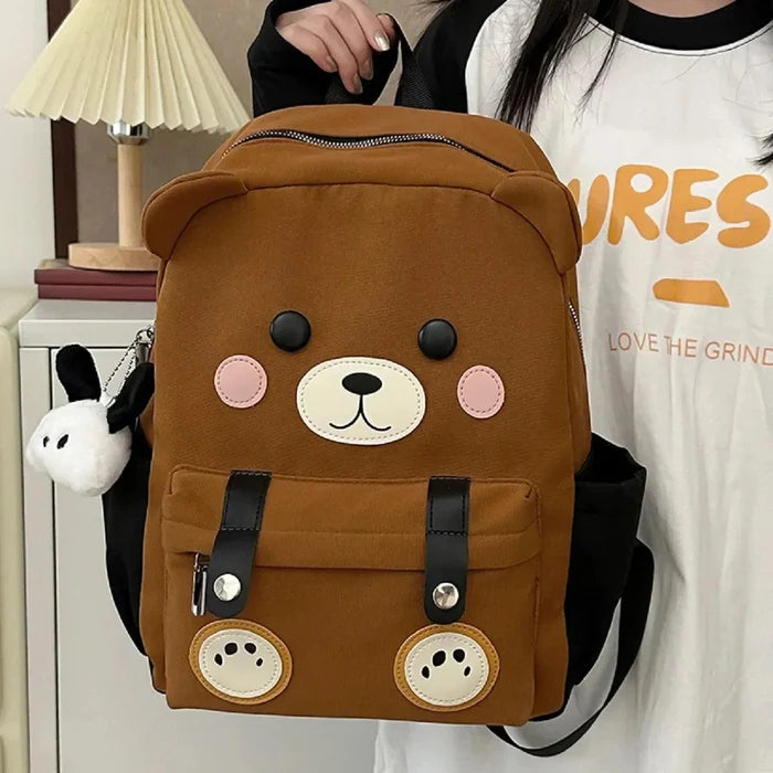 Brown cute bear backpack with bear-face patch, pink cheeks, and two front pockets