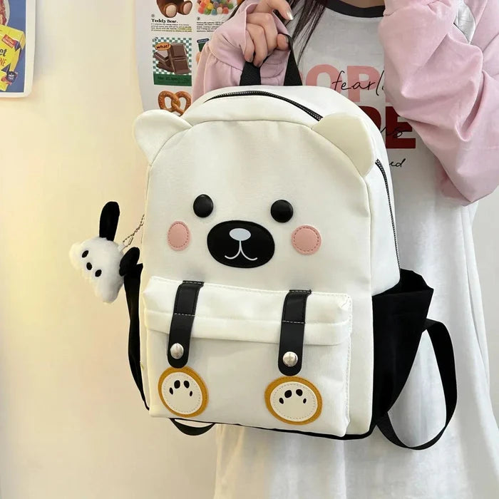 White cute bear backpack with bear-face patch, pink cheeks, and two front pockets
