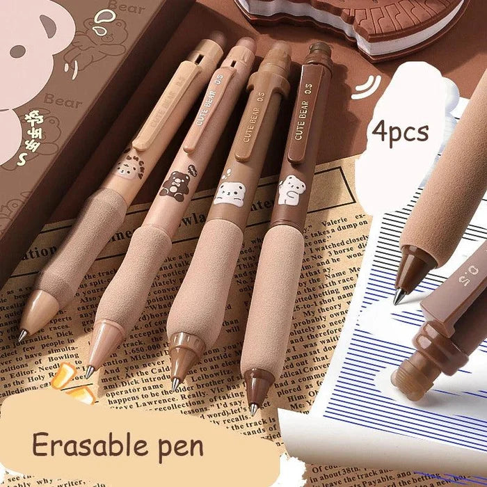 Set of four soft grip gel pens with cute bear and paw prints on light tan barrels