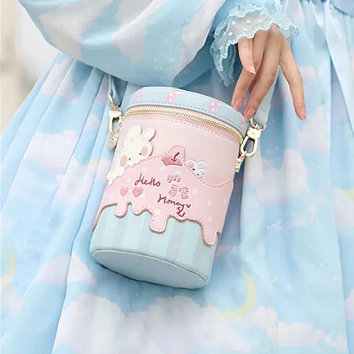 Pink and light blue bunny crossbody bucket bag, front bunny applique and heart print, zip top