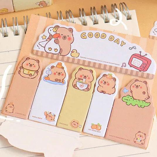 Capybara-themed sticky notes set with assorted pastel note bookmarks in a spiral pad