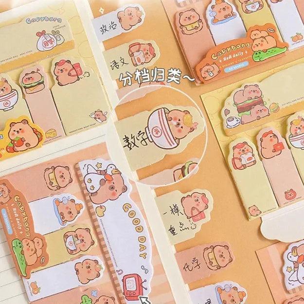 Capybara bookmark sticky notes, small character designs with pastel note tabs laid out