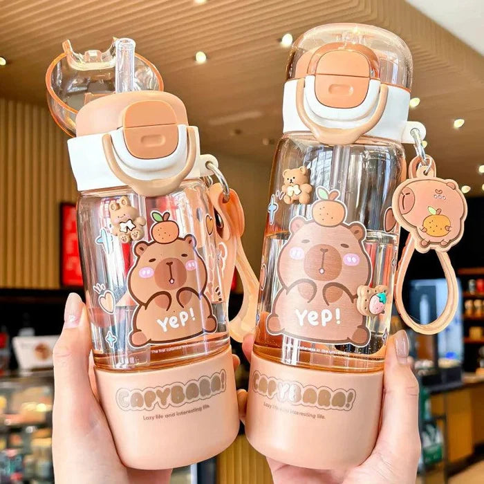 Two clear capybara water bottles with peach lids, strap clips, and cartoon “Yep!”