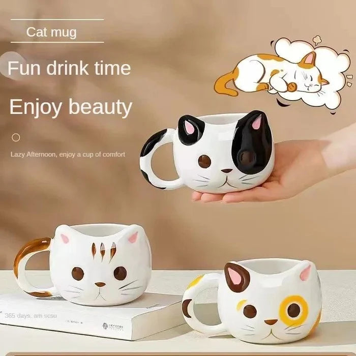 Cat-shaped ceramic mug, white with black ear spots and pink nose detail