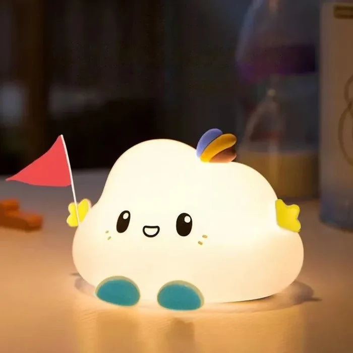 Cloud LED night light on a table with a small red flag and warm glow.