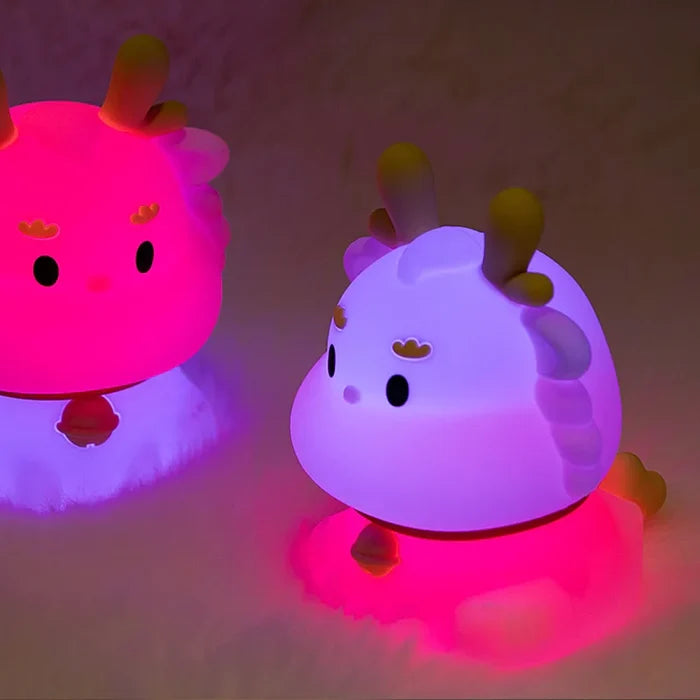 Cute dragon night light with vibrant multicolor LED glow and rounded shape