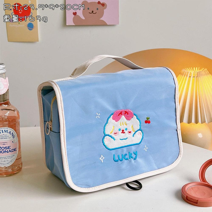 Cute makeup bag with flap, light blue fabric, cloud character applique with “Lucky”