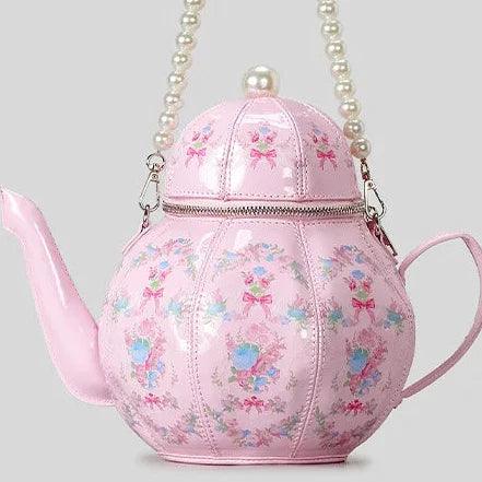 Pink teapot-shaped tea party bag with pearl-look chain and floral print
