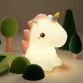 Glowing unicorn LED night light with horn and cute face, sitting upright