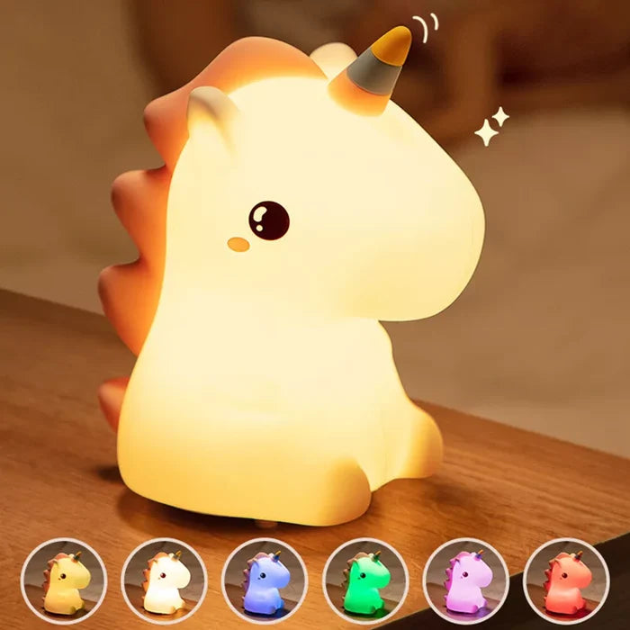 Glowing unicorn LED night light, side view with horn and smiling face