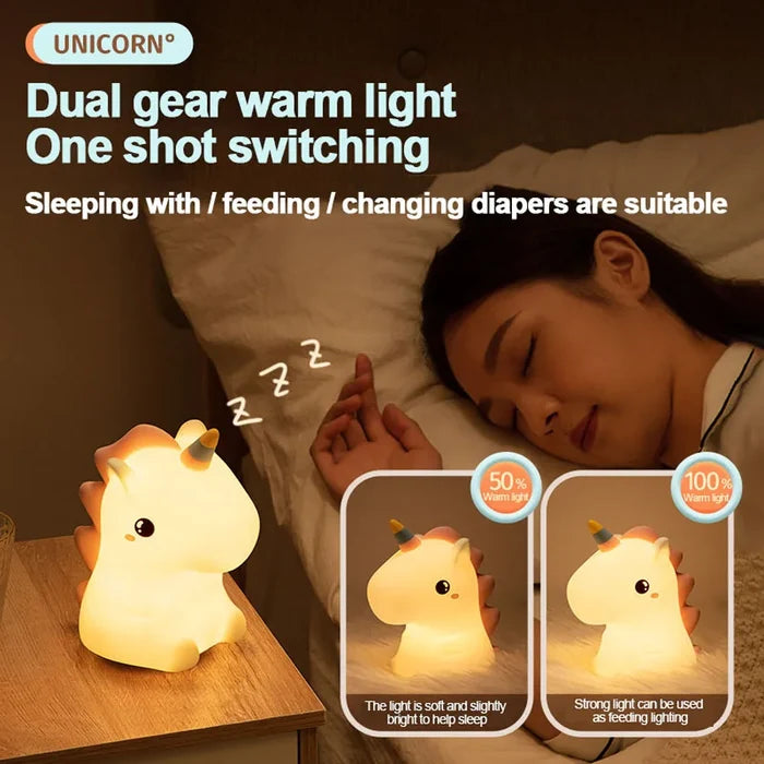 Glowing unicorn LED night light on a bedside table, facing left