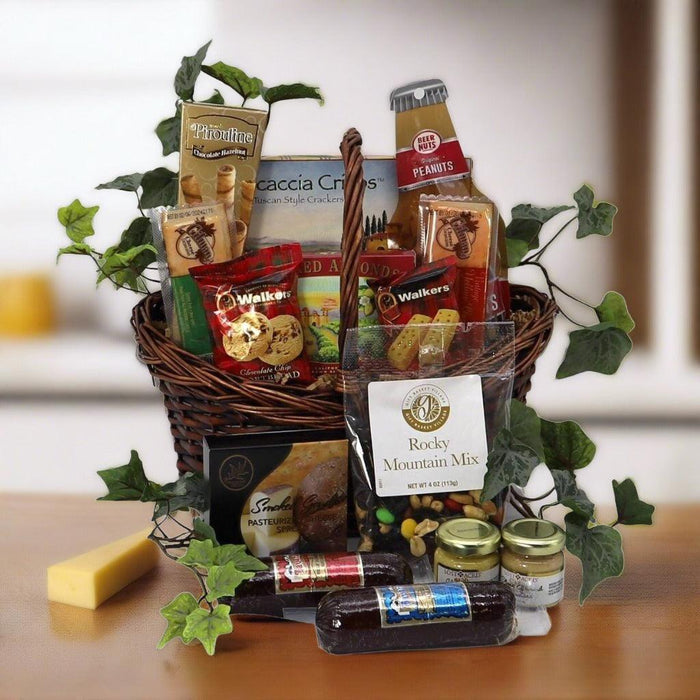 Wicker gift basket filled with assorted snack bags, jars, and cracker boxes