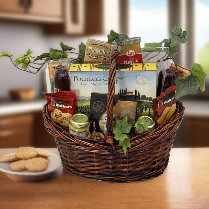 Wicker gift basket with assorted gourmet snacks, jars, and wrapped cookies on tray