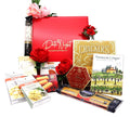 Red gift box set with crackers, wafers, and rose-topped decorations