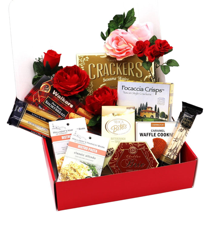 Red gift box with crackers, focaccia crisps, wafers, and assorted snack packages