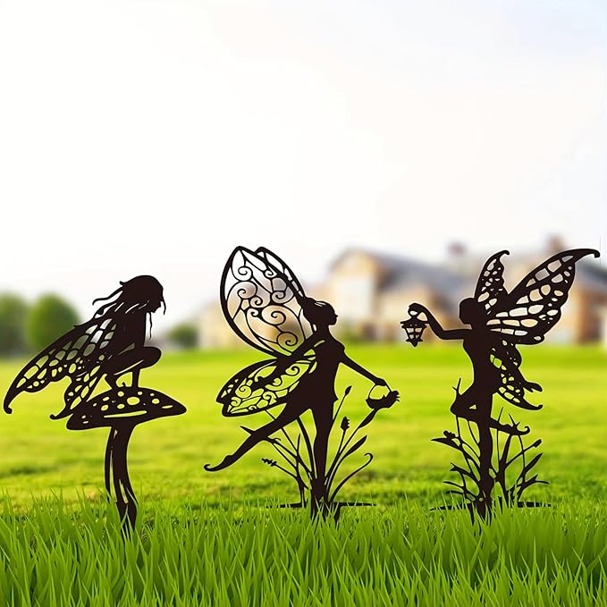 Three dark metal fairy garden stakes with winged fairy and lantern cutouts