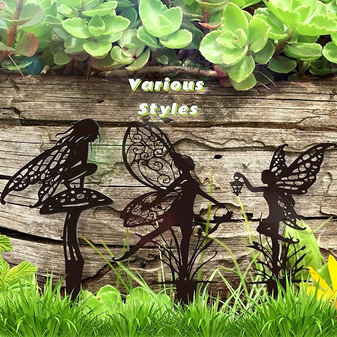 Three dark metal fairy garden stakes with winged fairy silhouettes for planting
