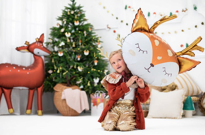 Deer balloon with orange-and-white face and gold antler balloons