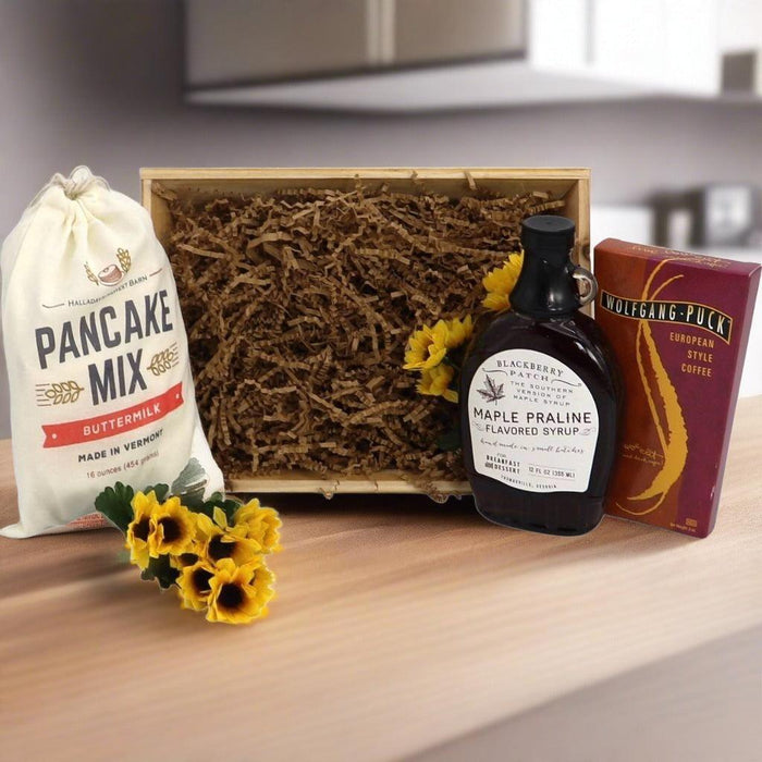 Open breakfast gift crate with pancake mix bag, maple praline syrup, coffee box