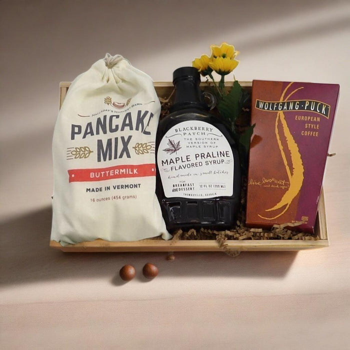 Breakfast gift crate with pancake mix bag, black maple praline syrup bottle, coffee box