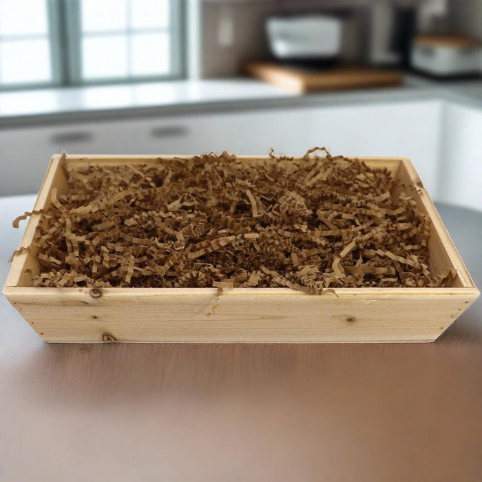 Wood gift crate filled with shredded brown filler