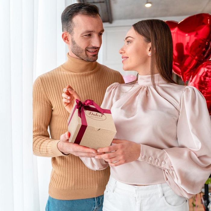 Valentine's Day gift basket held by a couple