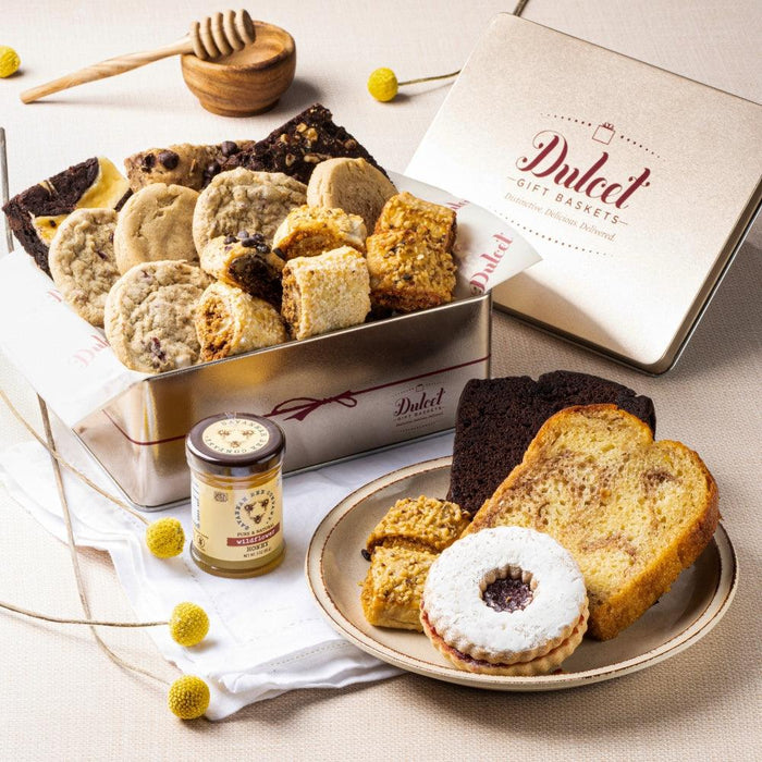 Deluxe honey and pastry gift tin with honey pastries, cookies, and loaf slice