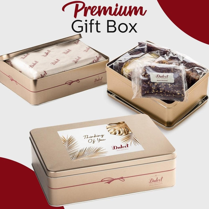 Premium gift box with plastic-wrapped pastries and Dulcet greeting card