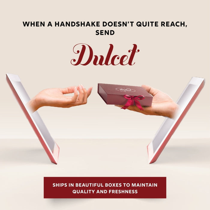 Deluxe pastry and tea gift set, Dulcet gift box with ribbon held by hands