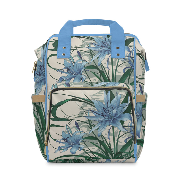 Diaper backpack with blue floral print, front zip organizer and top handle straps