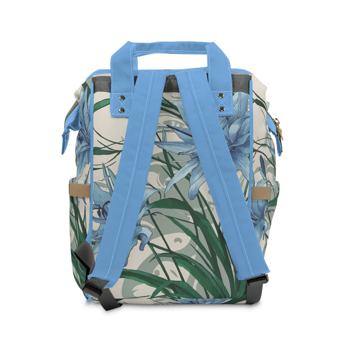 Diaper backpack with blue handles and floral print, back panel with adjustable straps