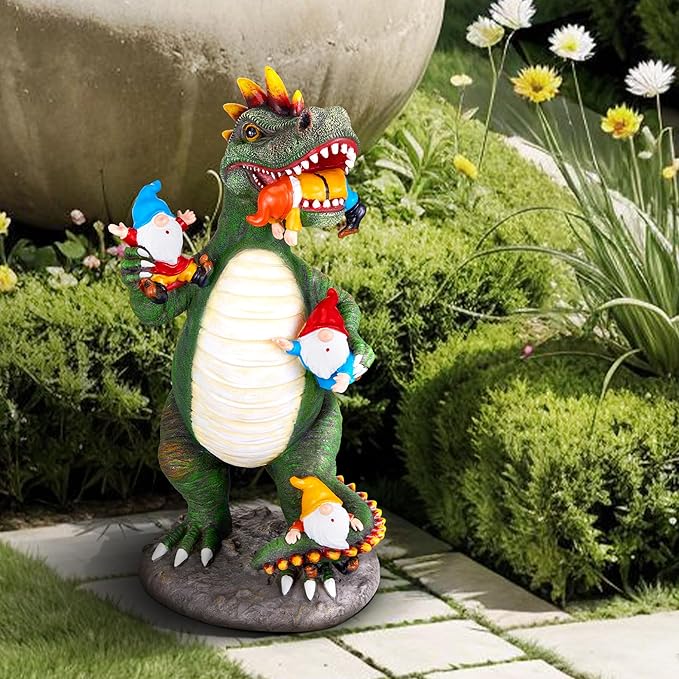 Green dinosaur gnome statue standing on gray base with white ribbed belly and red-hatted gnomes