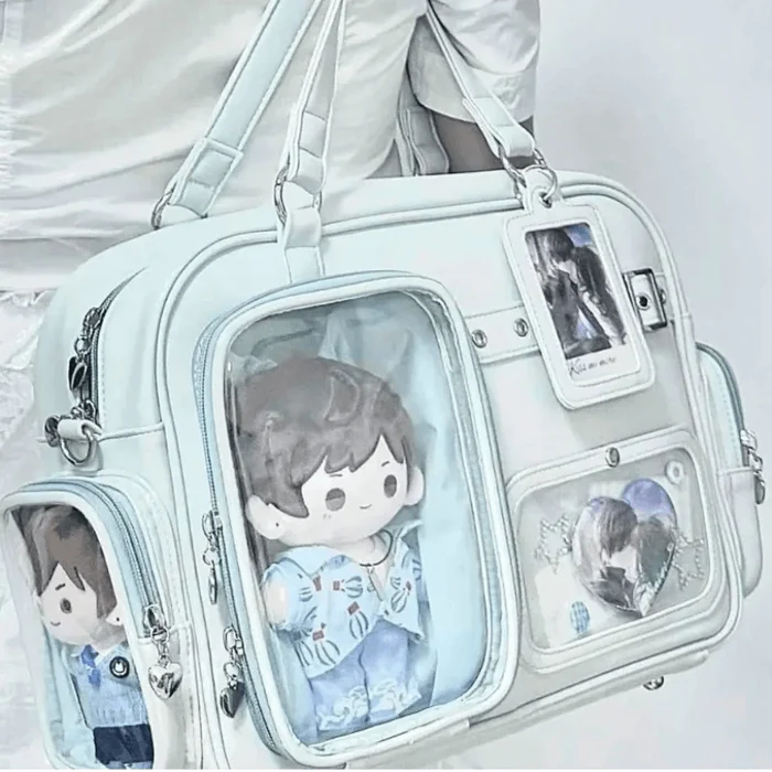 Light blue pastel crossbody bag with multiple clear window pockets and shoulder strap