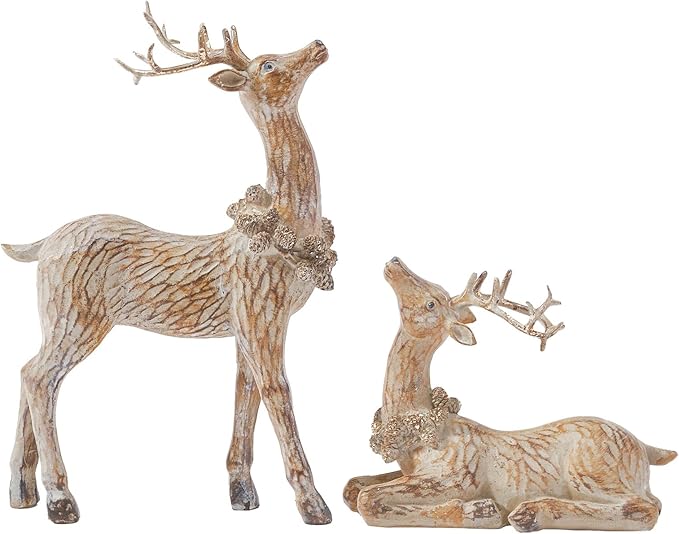Two resin reindeer figurines, one standing with antlers, one lying down, brown