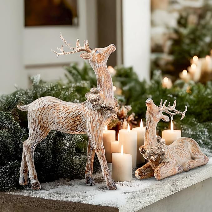 Resin reindeer figurines on a mantel shelf beside candles, standing and reclining, brown
