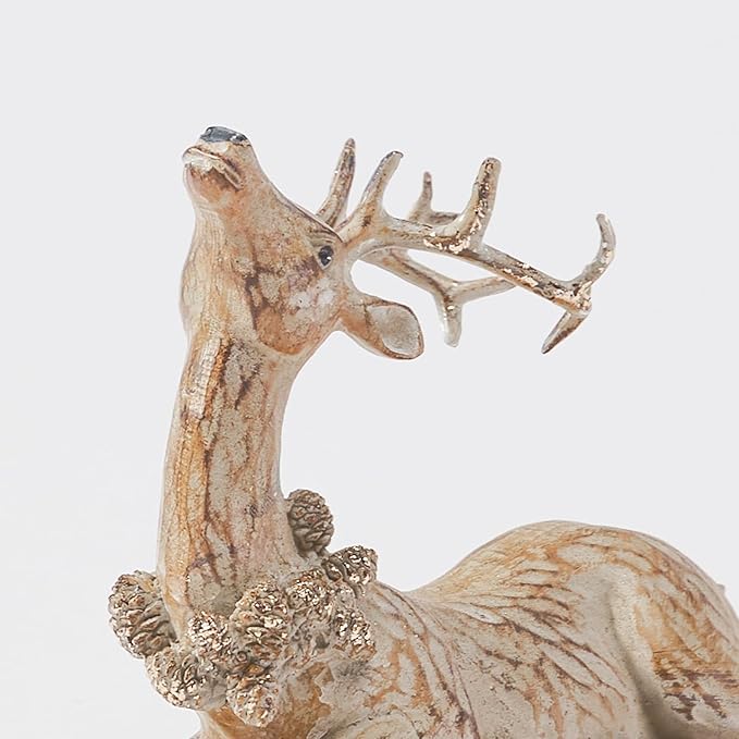 Close-up of a brown resin reindeer figurine with raised antlers and textured base