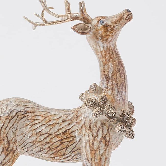 Close-up resin reindeer figurine standing with antlers, textured brown body, raised base