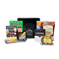 Assorted snack care package with crackers, coffee, tea, candy, and puzzle box