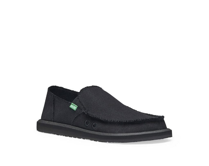 Sanuk Vagabond slip-on shoes in black with frayed edges, canvas upper, and cushioned sole, side view.