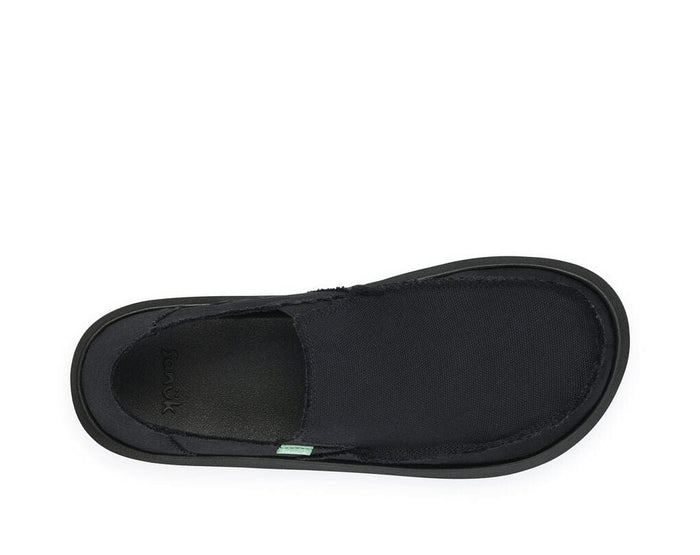 Sanuk Vagabond slip-on shoes in black with canvas upper and cushioned footbed, top view.
