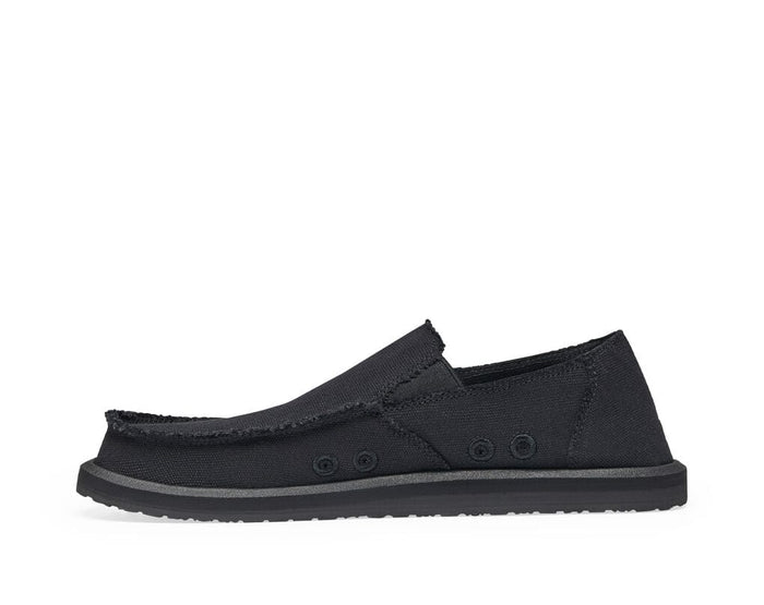 Sanuk Vagabond slip-on shoes in black with frayed edges, canvas upper, and lightweight outsole, side view.