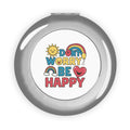Silver glossy compact travel mirror with “DON'T WORRY BE HAPPY” printed on cover