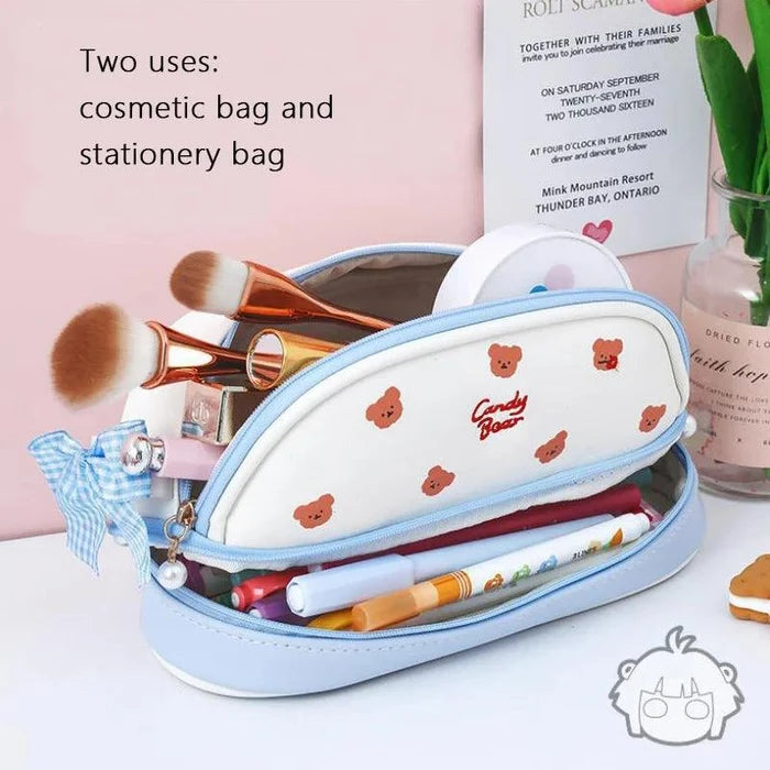 Light blue and white double-compartment pencil bag with Candy Bear print on front.