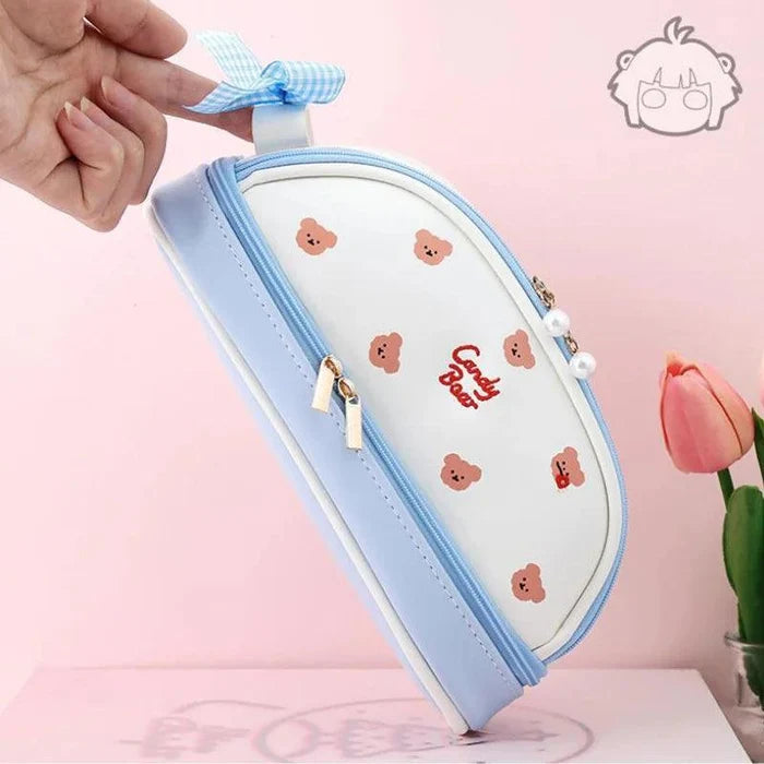Blue and white double-compartment pencil bag with bear icons and bow tie detail.