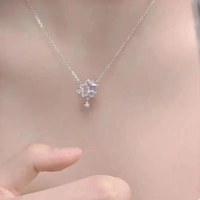 Rhinestone star pendant necklace with blue center gem and small dangling star