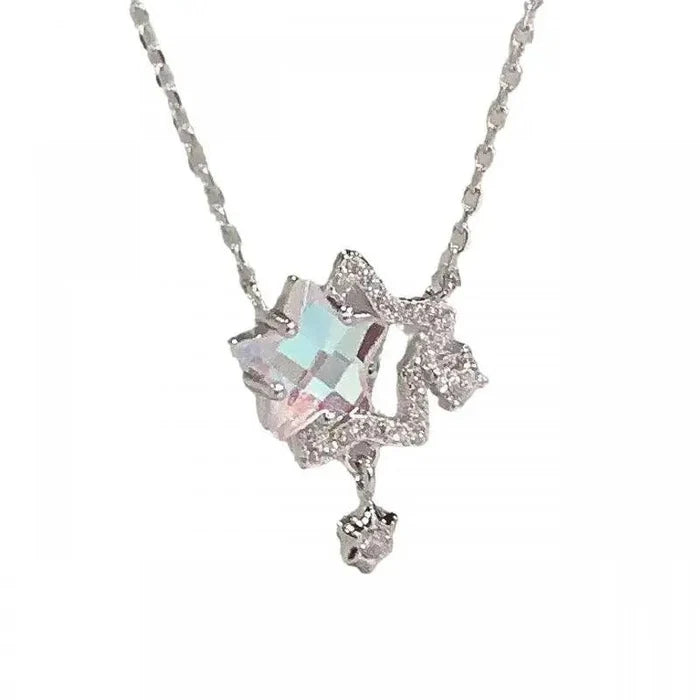 Rhinestone pendant necklace with blue square center, glittered frame, and star charm