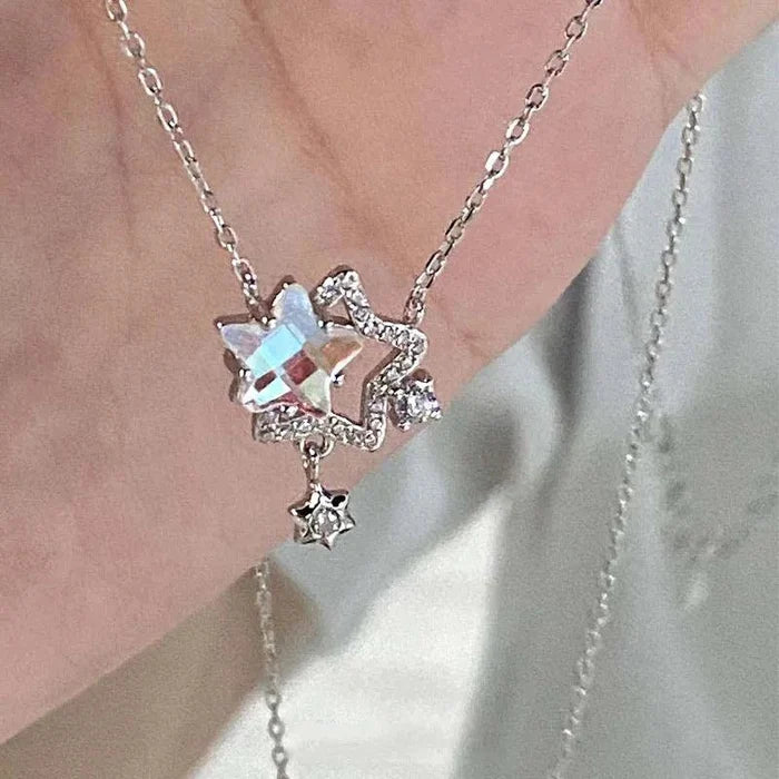 Rhinestone star pendant necklace with blue gem and dangling small star on chain